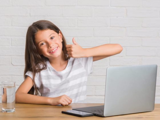 girl coding thumbs up